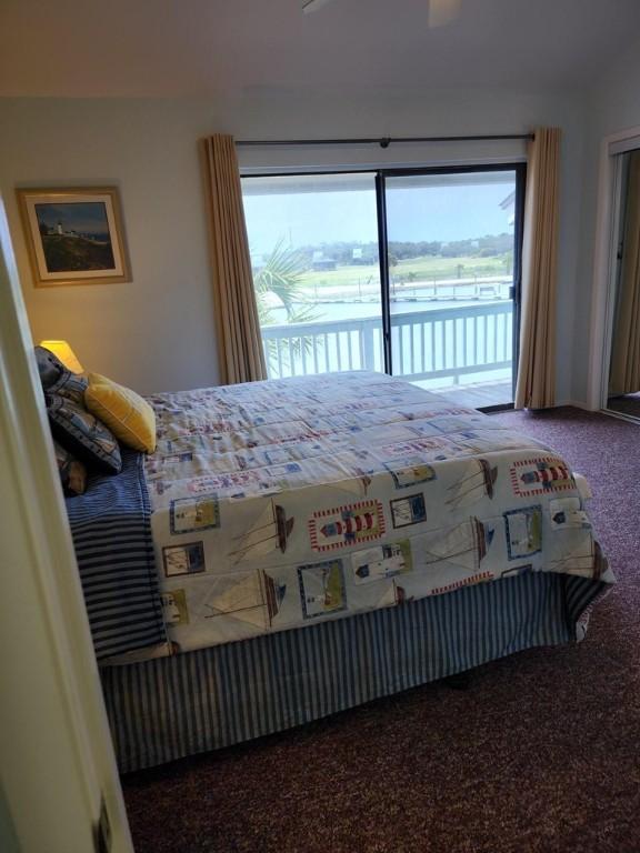 2292 N Fulton Beach Rd, Rockport, TX 78382 - bedroom with access to outside and carpet