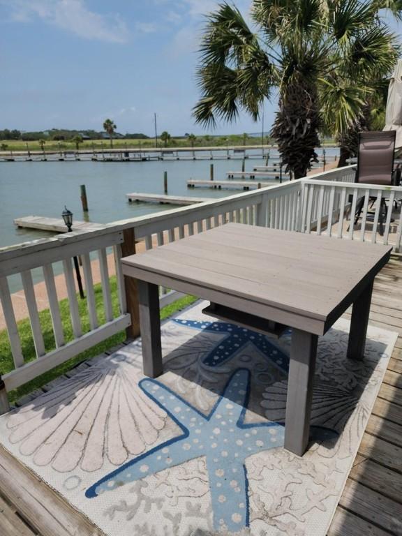 2292 N Fulton Beach Rd, Rockport, TX 78382 - wooden deck with a water view and a boat dock