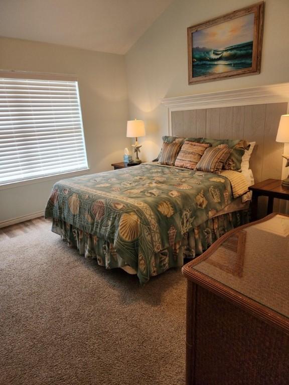 2292 N Fulton Beach Rd, Rockport, TX 78382 - carpeted bedroom featuring lofted ceiling