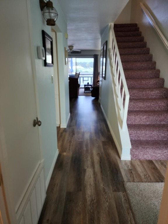 2292 N Fulton Beach Rd, Rockport, TX 78382 - hall featuring stairway, dark wood-style floors, and baseboards