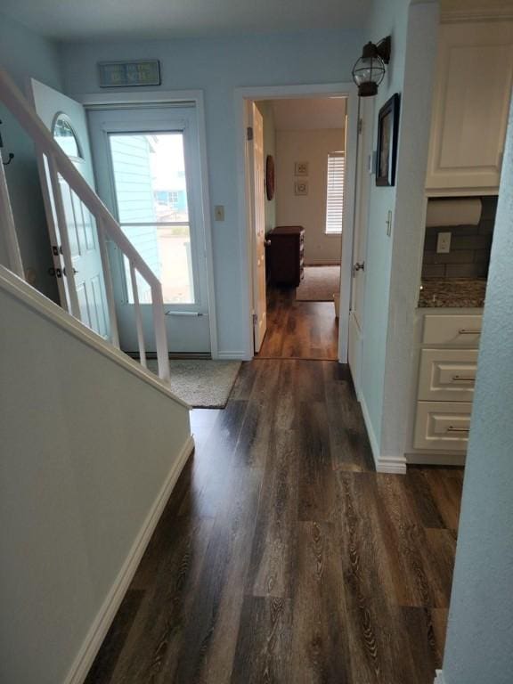 2292 N Fulton Beach Rd, Rockport, TX 78382 - hallway featuring dark wood-type flooring, stairway, and baseboards
