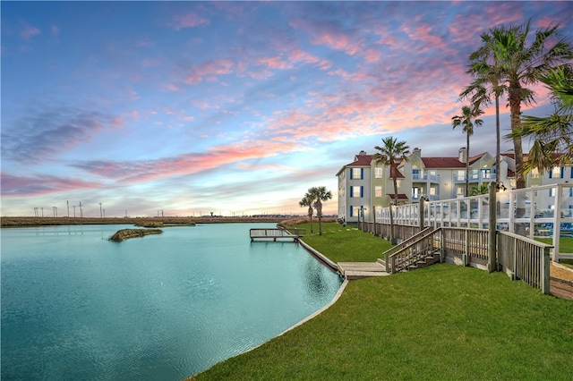 pool at dusk with a water view