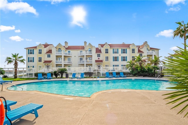 view of swimming pool with a patio area