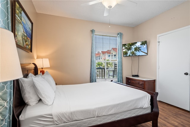 bedroom with ceiling fan and hardwood / wood-style floors