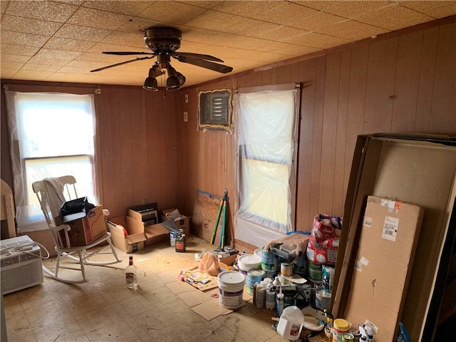 122 3rd St, Lake City, TX 78368 - misc room featuring tile patterned floors, ceiling fan, and wooden walls