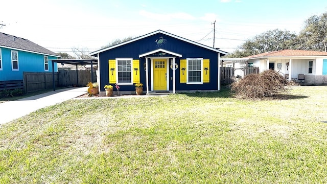 bungalow-style house featuring fence and a front yard
