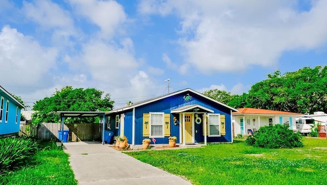 719 E King St, Rockport, TX 78382 - bungalow featuring concrete driveway and an attached carport