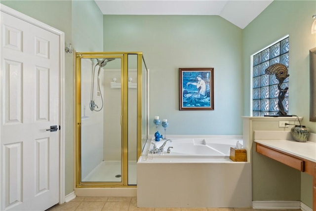 6217 Garden Ct, Corpus Christi, TX 78414 - bathroom featuring a shower stall, a bath, tile patterned flooring, and lofted ceiling