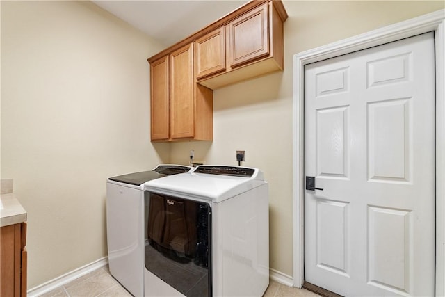 6217 Garden Ct, Corpus Christi, TX 78414 - clothes washing area featuring separate washer and dryer, cabinet space, baseboards, and light tile patterned floors
