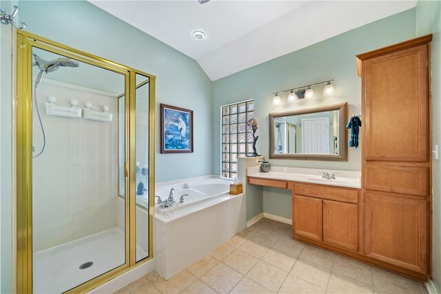 6217 Garden Ct, Corpus Christi, TX 78414 - bathroom with a stall shower, lofted ceiling, a garden tub, tile patterned flooring, and vanity
