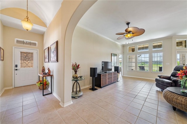 6217 Garden Ct, Corpus Christi, TX 78414 - entrance foyer featuring light tile patterned floors, arched walkways, baseboards, ornamental molding, and ceiling fan