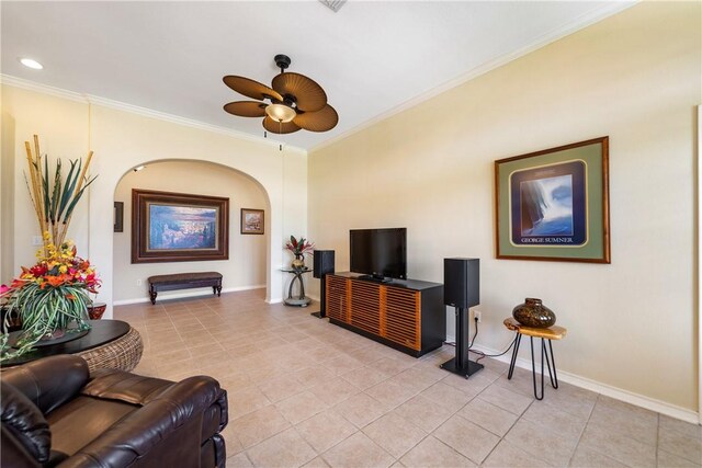 6217 Garden Ct, Corpus Christi, TX 78414 - living room featuring arched walkways, a ceiling fan, crown molding, light tile patterned floors, and baseboards