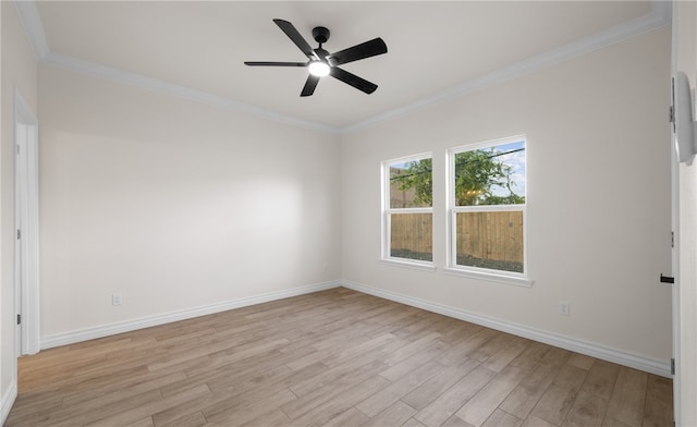 empty room featuring light wood-type flooring, ceiling fan, and crown molding