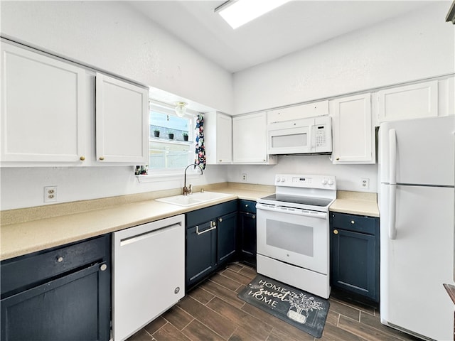 kitchen featuring dark hardwood / wood-style floors, white cabinetry, white appliances, and sink