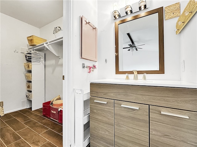 bathroom featuring vanity and ceiling fan