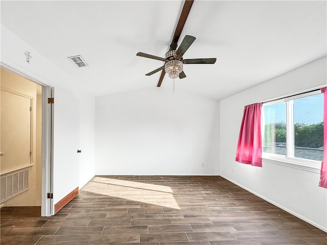 spare room with dark hardwood / wood-style flooring, ceiling fan, and lofted ceiling