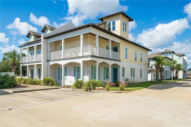 view of front of house with a balcony