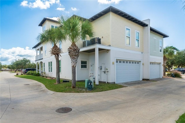 view of side of home with a garage