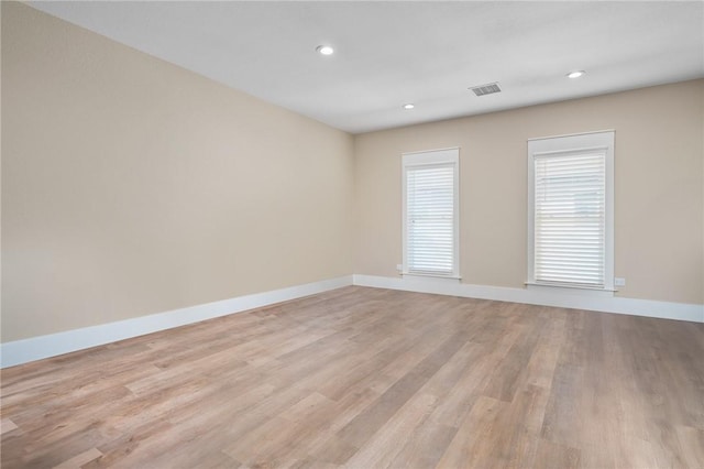 unfurnished room featuring light hardwood / wood-style flooring