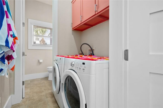 washroom featuring washer and dryer and light tile patterned floors