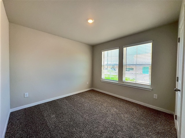 3014 Stone Creek Dr, Corpus Christi, TX 78410 - spare room with dark carpet, baseboards, and recessed lighting