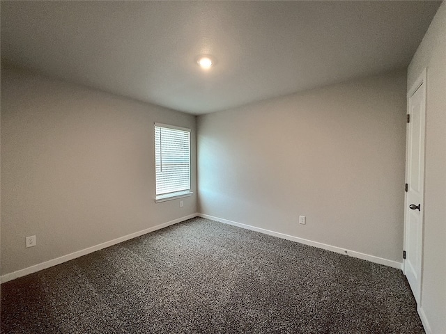 3014 Stone Creek Dr, Corpus Christi, TX 78410 - empty room featuring dark carpet and baseboards
