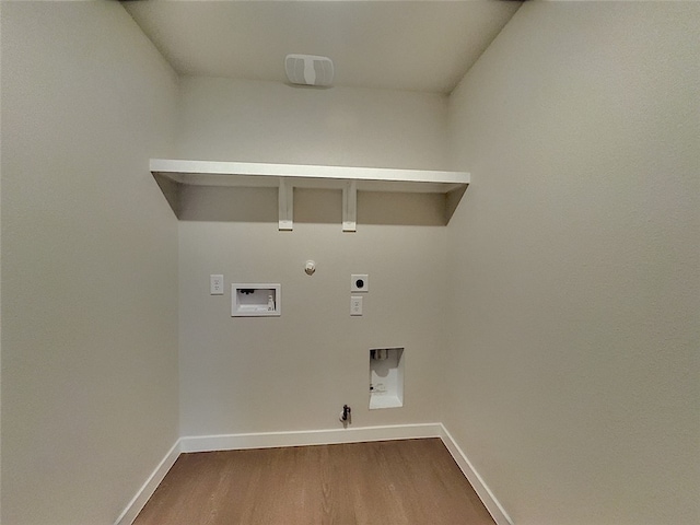 3014 Stone Creek Dr, Corpus Christi, TX 78410 - laundry area with hookup for a gas dryer, electric dryer hookup, hookup for a washing machine, and baseboards