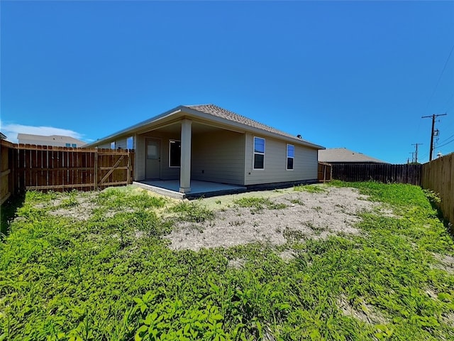 3014 Stone Creek Dr, Corpus Christi, TX 78410 - rear view of house featuring a patio and a fenced backyard