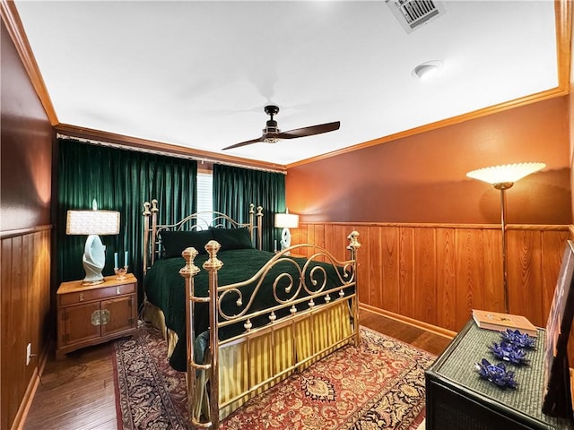130 Alta Plz, Corpus Christi, TX 78411 - bedroom with wainscoting, crown molding, wood finished floors, wood walls, and baseboards