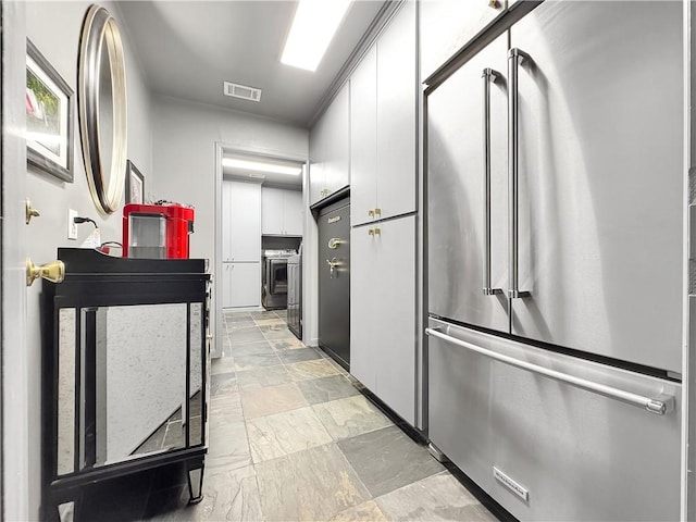 130 Alta Plz, Corpus Christi, TX 78411 - kitchen with high quality fridge, white cabinets, and light marble finish flooring
