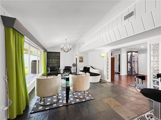 130 Alta Plz, Corpus Christi, TX 78411 - living room with a chandelier, lofted ceiling, and stone tile floors