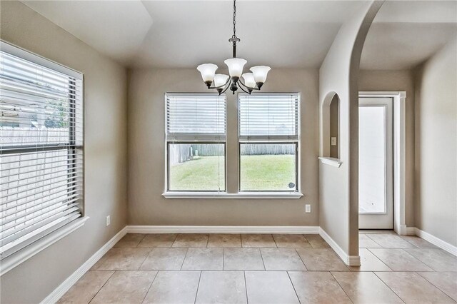 4384 Summer Wind Dr, Corpus Christi, TX 78413 - unfurnished dining area with healthy amount of natural light, a chandelier, and light tile patterned flooring