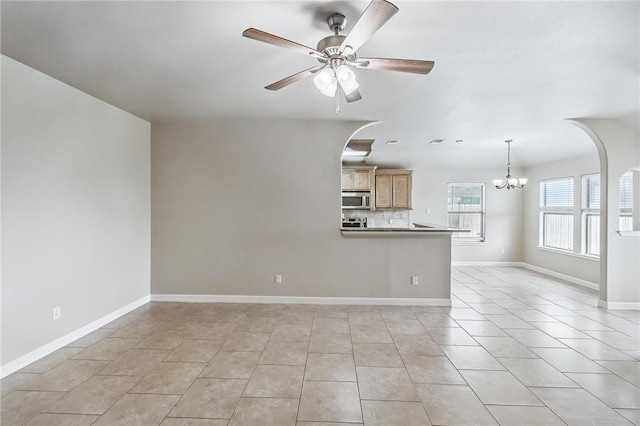 4384 Summer Wind Dr, Corpus Christi, TX 78413 - unfurnished living room with a chandelier, a ceiling fan, and light tile patterned flooring