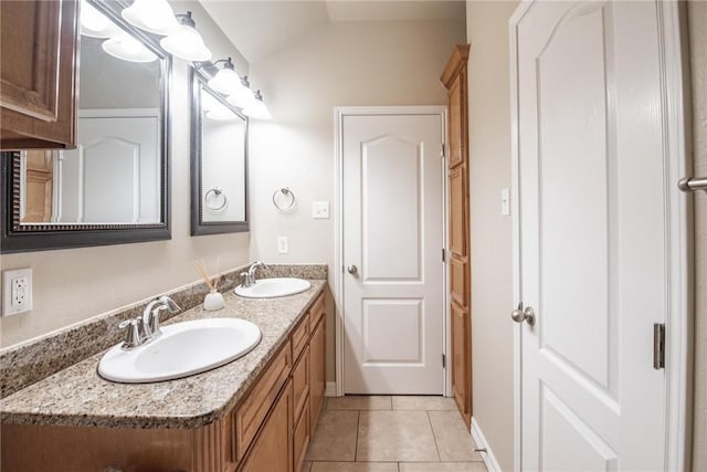 4384 Summer Wind Dr, Corpus Christi, TX 78413 - full bath with double vanity, tile patterned flooring, and vaulted ceiling