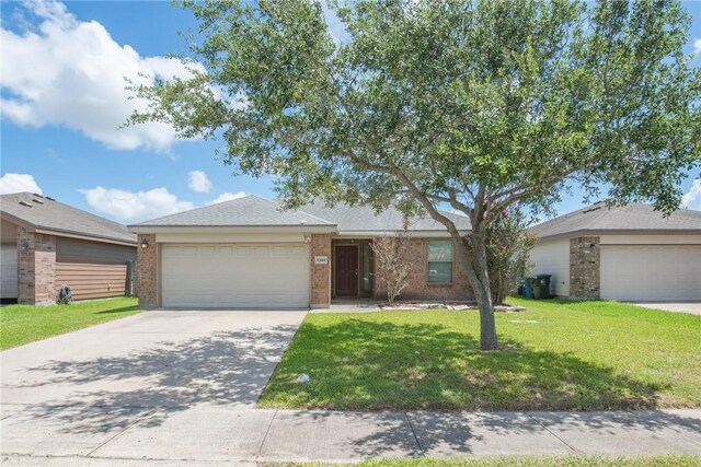 4384 Summer Wind Dr, Corpus Christi, TX 78413 - ranch-style home with driveway, a garage, a front yard, and brick siding