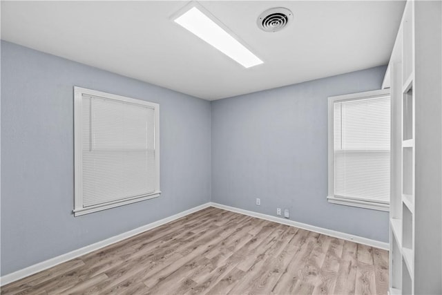 1006 Vernon Dr, Corpus Christi, TX 78407 - spare room featuring light wood-type flooring and baseboards