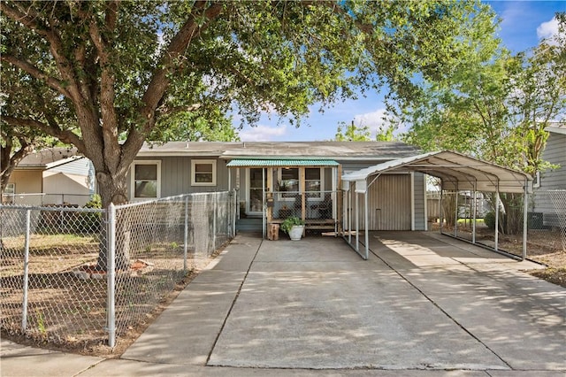 1006 Vernon Dr, Corpus Christi, TX 78407 - view of front of home featuring a detached carport and driveway