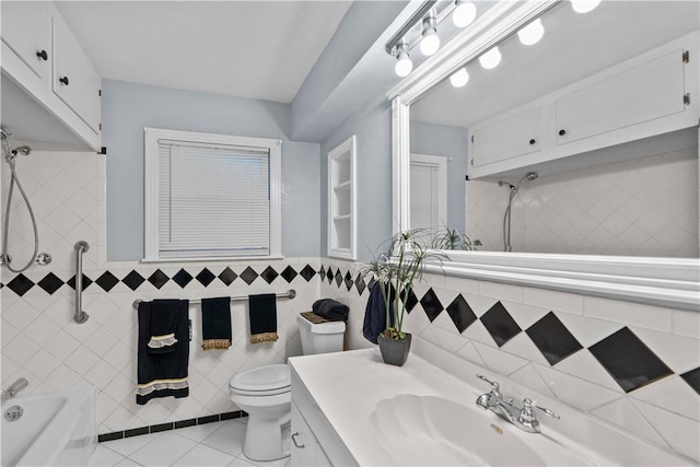 1006 Vernon Dr, Corpus Christi, TX 78407 - bathroom with tile walls, bathing tub / shower combination, vanity, toilet, and tile patterned floors