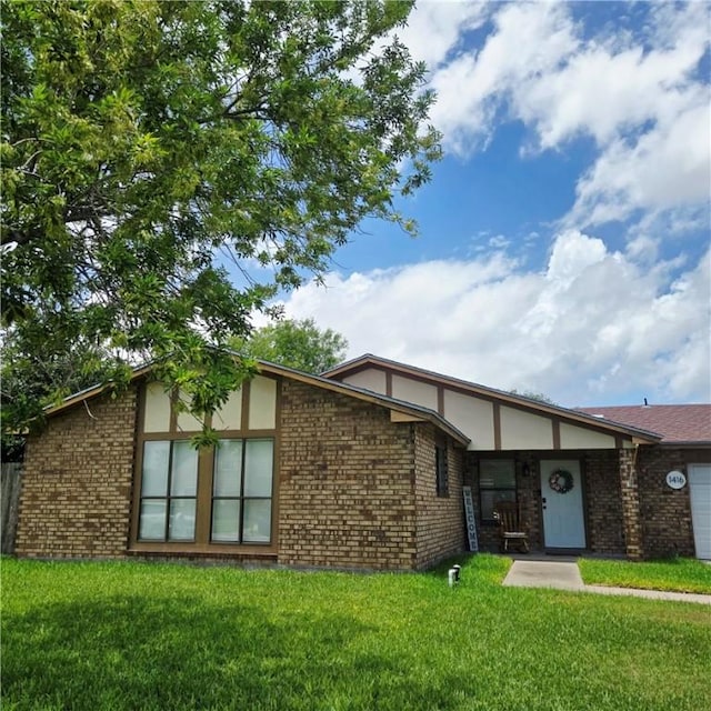 1416 Christy Ave, Kingsville, TX 78363 - view of front of home with a front yard and brick siding