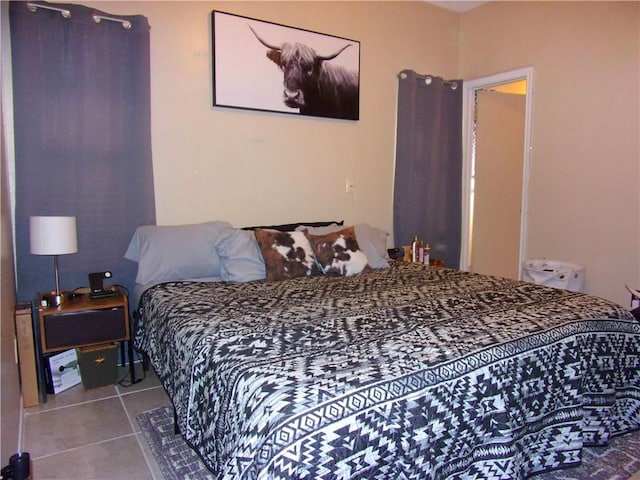 bedroom featuring tile patterned flooring