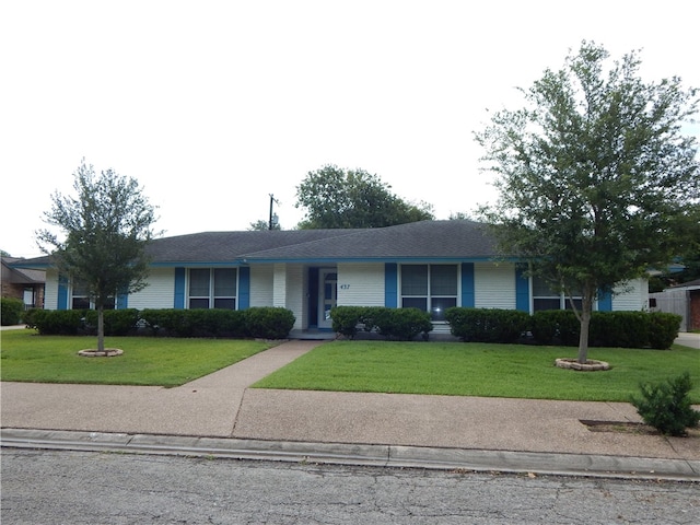 ranch-style house featuring a front lawn