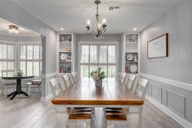 108 Lost Creek Dr, Portland, TX 78374 - dining room with built in features, a chandelier, light wood finished floors, baseboards, and recessed lighting