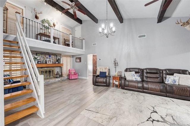 108 Lost Creek Dr, Portland, TX 78374 - living area featuring ceiling fan, stairway, wood finished floors, beam ceiling, and a towering ceiling