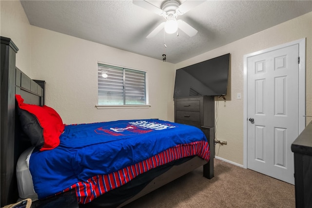 bedroom with carpet, a textured ceiling, and ceiling fan