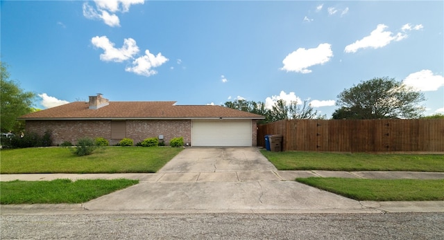 view of front facade with a garage and a front lawn