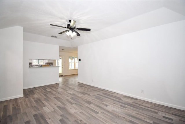 unfurnished living room featuring hardwood / wood-style floors and ceiling fan