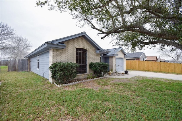 ranch-style home with a garage and a front yard