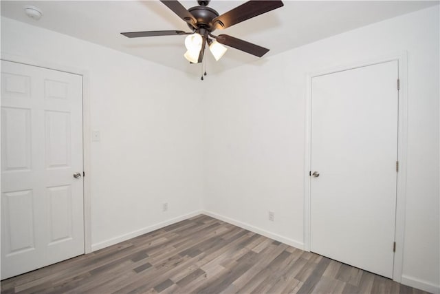 unfurnished bedroom with hardwood / wood-style flooring and ceiling fan