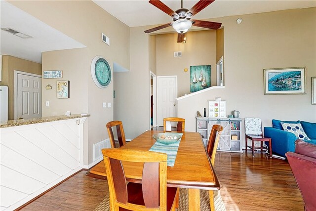 dining room featuring dark hardwood / wood-style flooring and ceiling fan