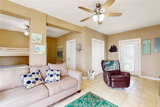 tiled living room with electric panel and ceiling fan